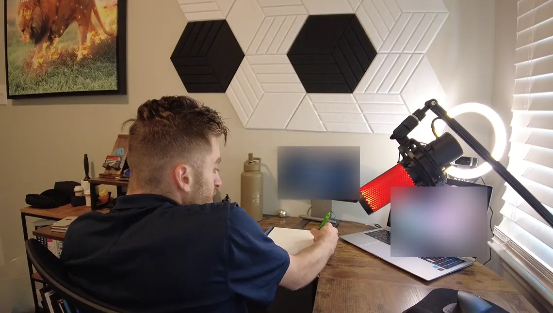 Noah taking notes during a video coaching call