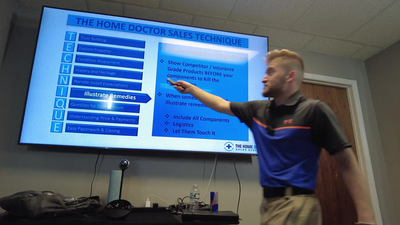 Noah pointing to the Illustrate Remedies step on a Home Doctor Sales Technique slide